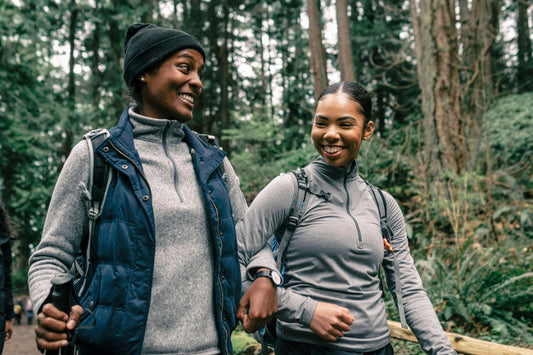 Two black women walking in the woods